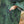 Load image into Gallery viewer, Close up view of sleeve and pocket of Dessous Loungewear Bianca caftan midi dress in green and navy print sustainable Lyocell fabric.