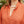 Load image into Gallery viewer, Close up of blond woman wearing Dessous Loungewear Bianca caftan in small orange and red print sustainable Lyocell fabric.