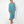 Load image into Gallery viewer, Beautiful black woman wearing Dessous Loungewear Bianca caftan midi dress in sustainable turquoise Lyocell fabric.