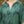 Load image into Gallery viewer, Close-up photo of a woman wearing a green and navy marble print caftan in eco-friendly Tencel Lyocell fabric. The caftan is maxi-length with a V neckline.