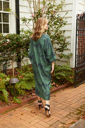 Back view of woman wearing Dessous Loungewear green and navy marble print sustainable Lyocell fabric.