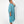 Load image into Gallery viewer, Side view of beautiful black woman wearing Dessous Loungewear&#39;s Bianca caftan midi dress in sustainable Lyocell turquoise fabric.

