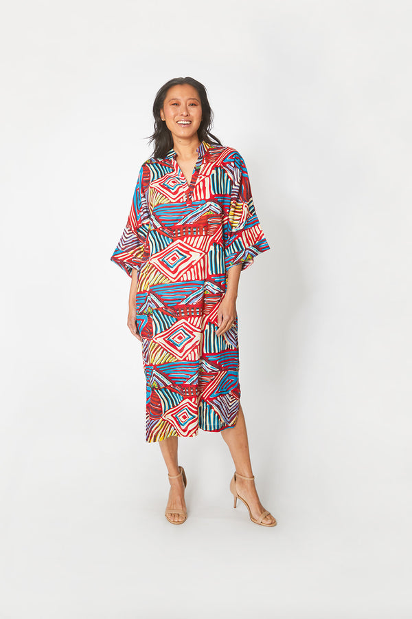 Pretty Asian woman wearing Dessous Loungewear's Bianca caftan in a cotton geometric print.
