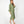 Load image into Gallery viewer, Side view of Beautiful Asian woman wearing Dessous Loungewear Bianca Caftan in moss green sustainable Lyocell fabric.
